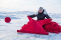 Maureen Gruben prepares her materials for "Stitching My Landscape" on a section of the ice road outside Tuktoyaktuk, N.W.T. on March 9, 2017