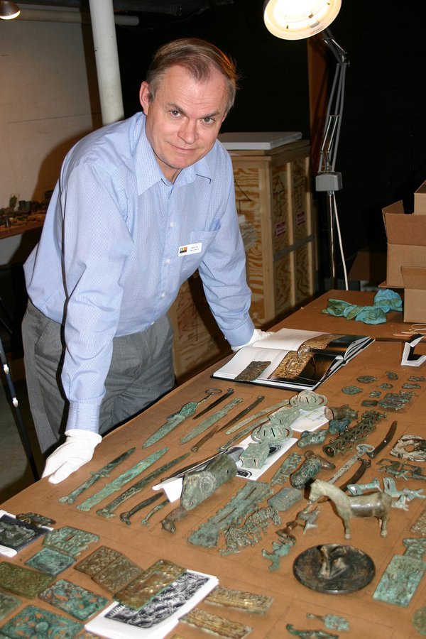 Curator of Asian Art, Barry Till in 2004, examining approximately 700 ancient Chinese bronze artifacts being donated by Mr. and Mrs. Joey and Toby Tanenbaum of Toronto