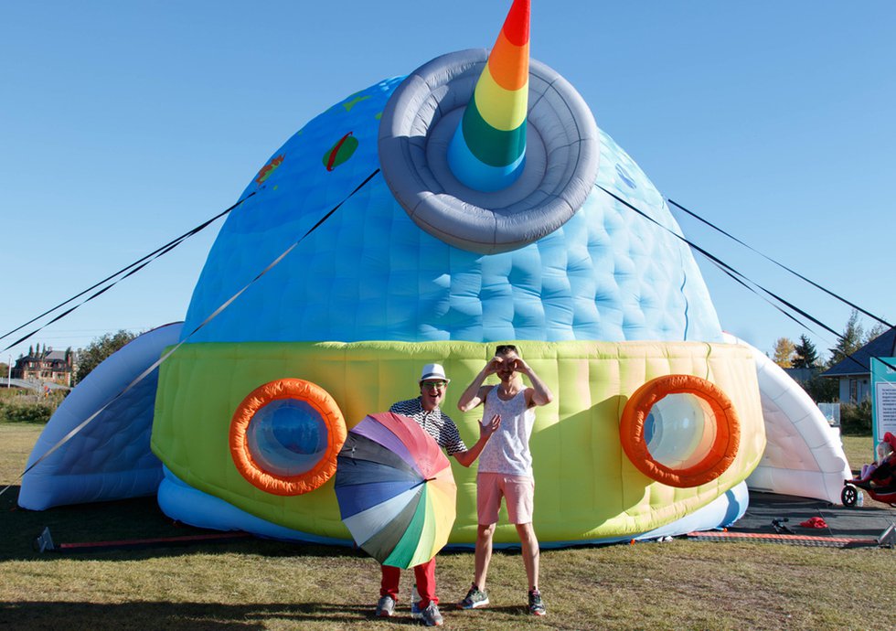 Bee Kingdom's Phillip Bandura (left) and Ryan Fairweather strike a pose outside their super-sized inflatable whale-spaceship hybrid, "The Saturnian."