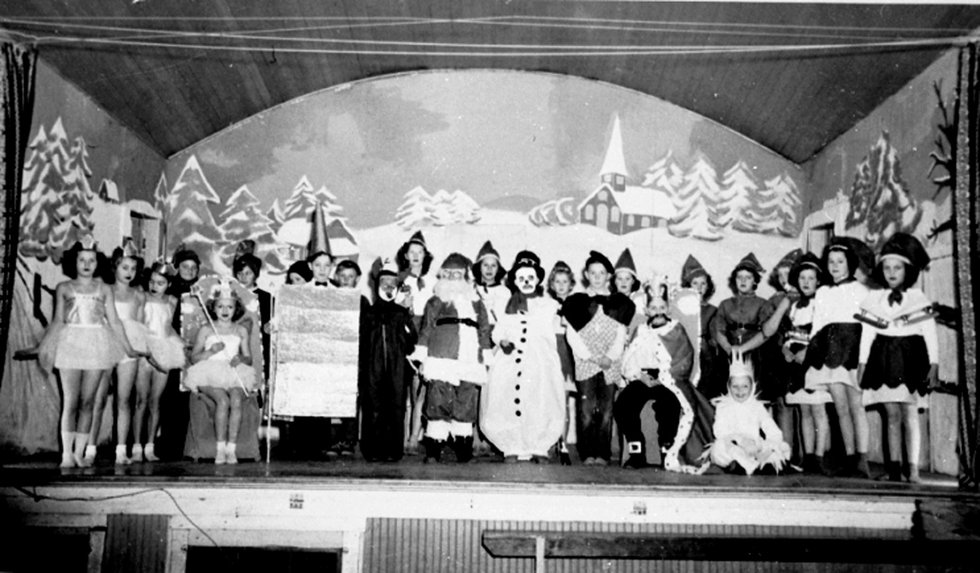 The Reach P5390- Children in costume, gathered on a stage at the Matsqui Hall for a winter pageant.