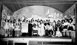 The Reach P5390- Children in costume, gathered on a stage at the Matsqui Hall for a winter pageant.