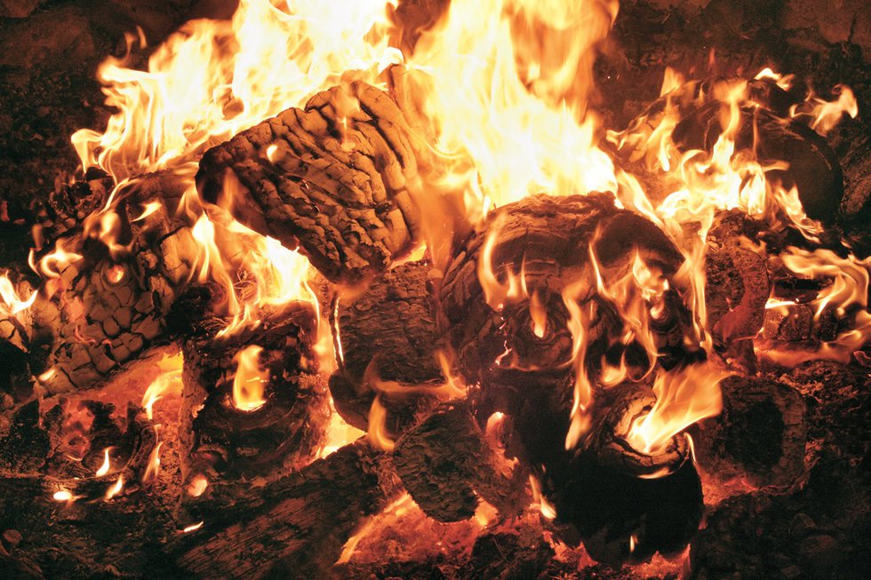 Atlak’ima masks burn at Beau Dick’s potlatch, hosted in the ’Namgis Big House, Alert Bay, B.C., in 2012. (photo courtesy of Steve Calvert)