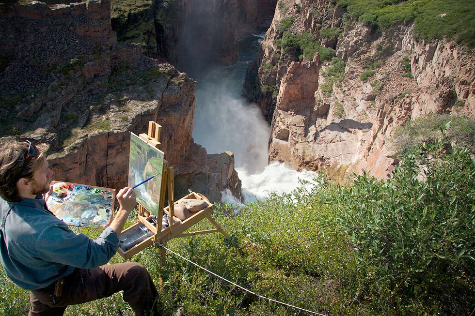 Cory Trépanier paints at Wilberforce Falls on the Hood River, west of Bathurst Inlet, Nunavut (photo by Max Attwood)