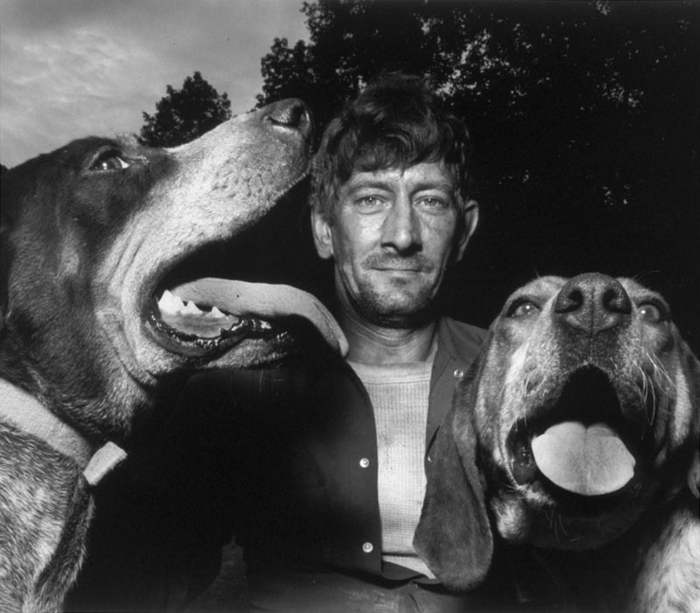 Shelby Lee Adams, “Chester with Hounds,” 1992 (private collection)