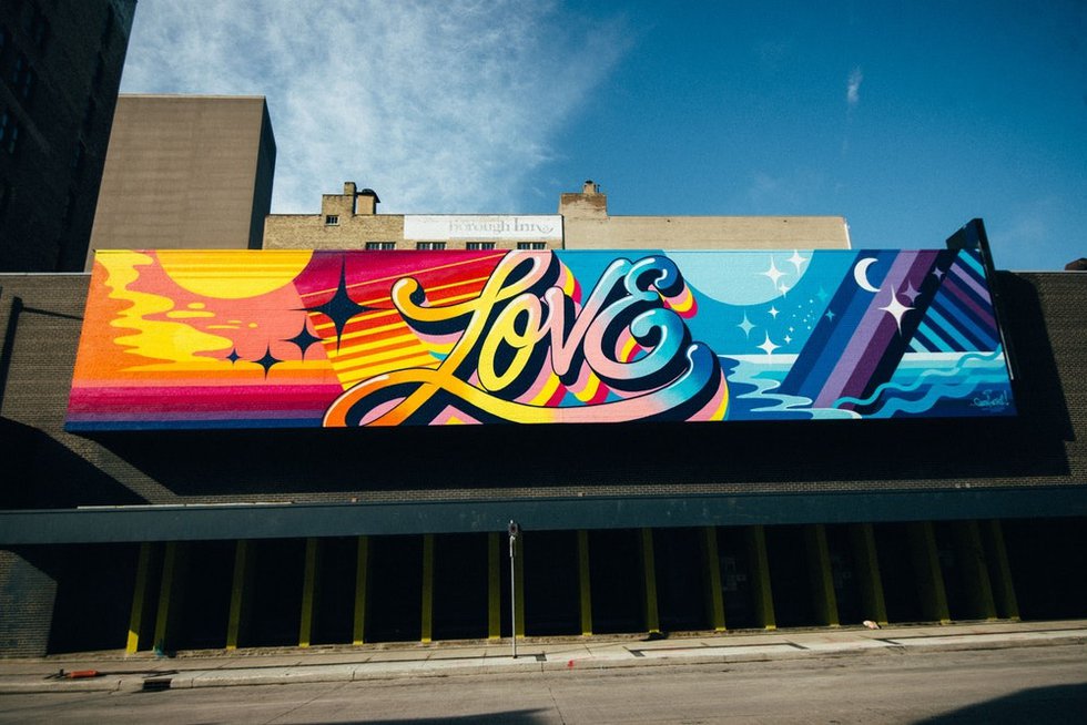 New York artist Queen Andrea created this mural, "Love All Day," on Garry Street in Winnipeg as part of this year's Wall-to-Wall mural festival. (photo courtesy of Synonym Art Consultation)