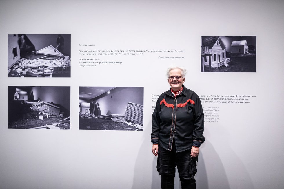 Rita McKeough poses with her work, “Feminist Reconstruction of Space,” a text excerpt from a document published in 2000