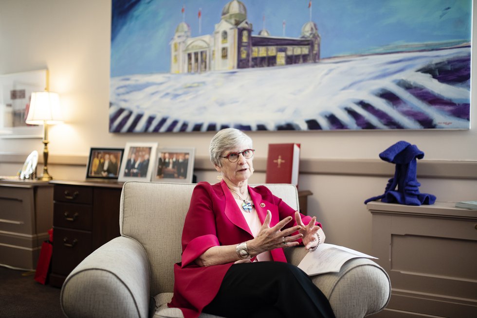 Patricia Bovey in her Ottawa office with “Winter Palace,” 2009, by Winnipeg artist David Owen Lucas. (courtesy the Senate of Canada)