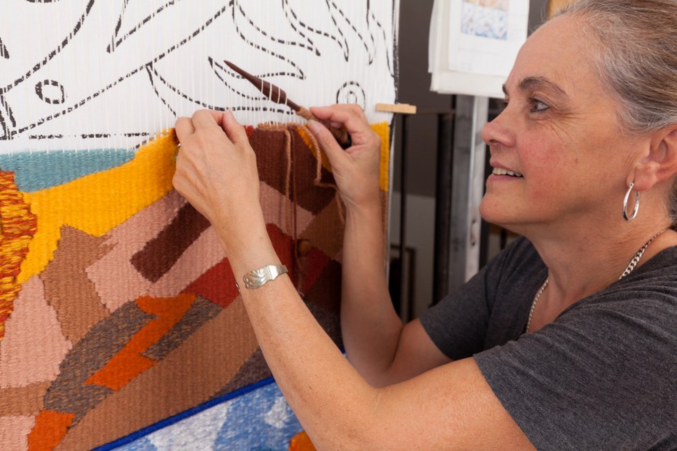 Carolina Sanchez de Bustamante weaves a 3D tapestry in her home studio in happier times. (courtesy the artist, photo by Yuri Akuney)