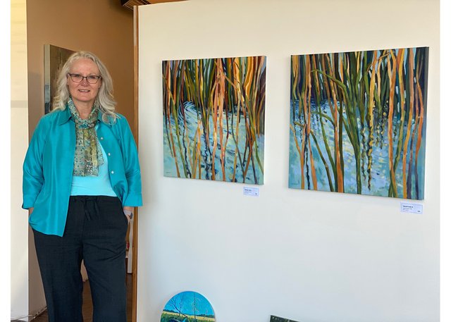 Riverlands Gallery installation with owner Carol Lynn Gilchrist
