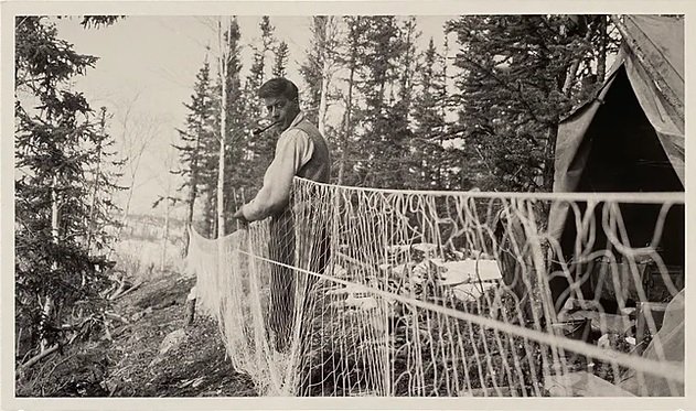 James Brady, "Malcolm Norris hanging nets," ca. 1934 (Glenbow Museum Collection, PA-2218-94)
