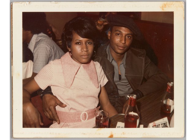 Unknown photographer, “[Man and woman sitting at table, his arm around her waist],” 1963-1970