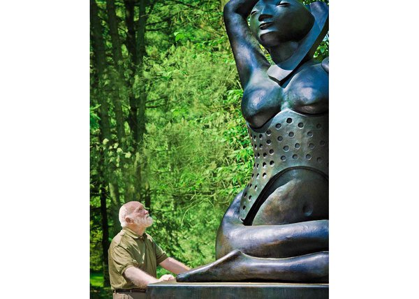 Ivan Eyre with "Lady Love" in the sculpture garden at the McMichael Canadian Art Collection in Kleinburg, Ont.  (photo courtesy Loch Gallery)