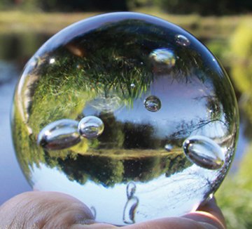 Penelope Stewart, “Beaver Pond, Orbs,” 2013, digital photograph and hand-blown crystal glass orb created for use as a lens, 20" diameter (framed; edition of 3, 3/3; collection of the artist)