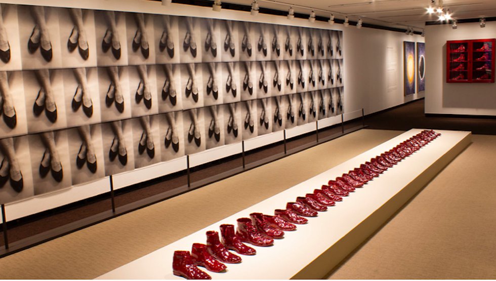 Gathie Falk, "a series of red glazed ceramic shoes and crossed ankles"