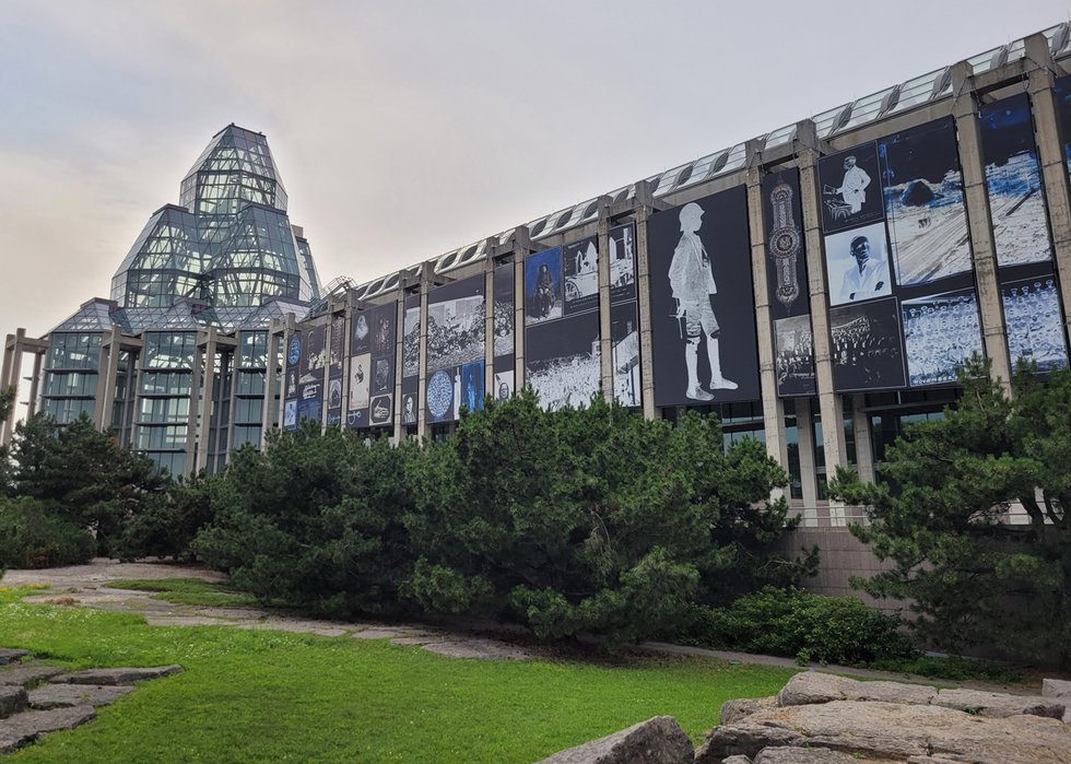 The south facade of the National Gallery of Canada in Ottawa showing Deanna Bowen’s installation, “The Black Canadians (after Cooke).” (photo by Amy Fung)
