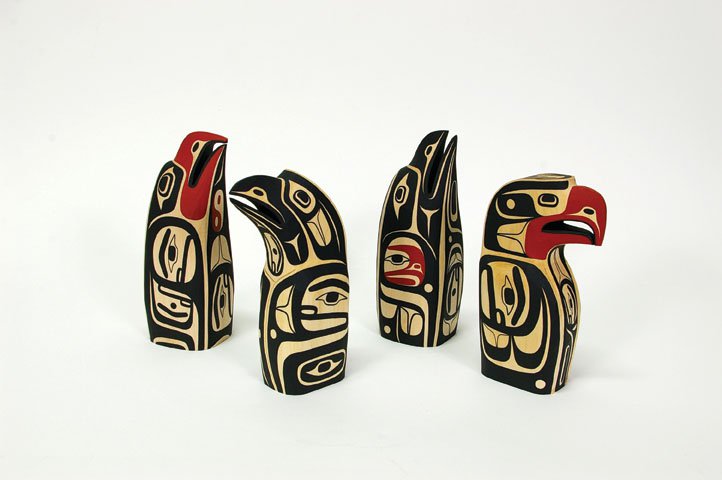 "Basswood Sculptures with acrylic paint, Eagle design, Raven design, Raven design, Eagle design." 