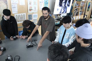 Through the Lens coordinator Nic Latulippe introduces high school students to photography processes.
