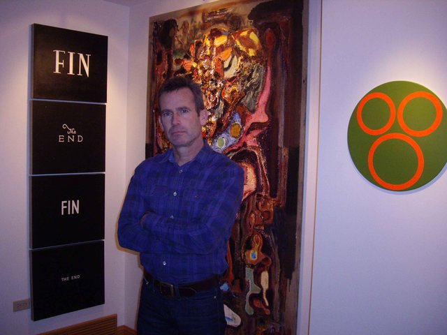 "Murray Quinn with some work from his collection"