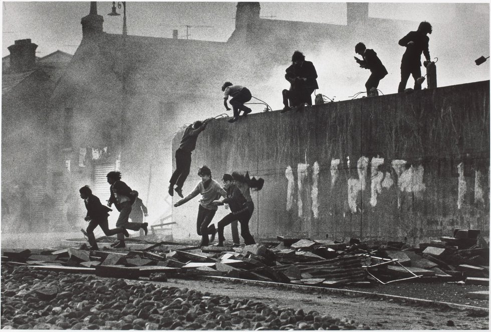 "Catholic youth escaping a CS gas assault in the Bogside, Londonderry"