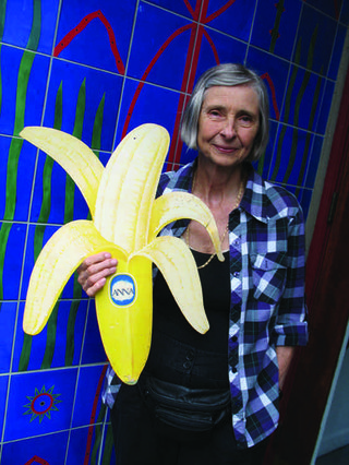 Anna Banana outside Open Space in Victoria with an artifact from her immense archive of banana paraphernalia. Photo by Portia Priegert